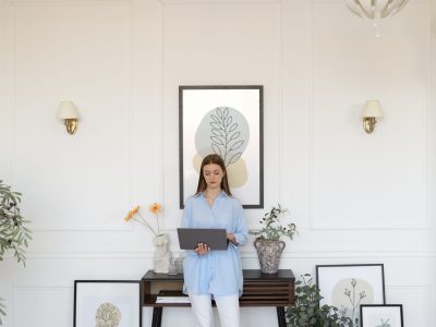 woman-using-laptop-minimal-decorated-room